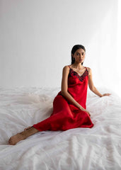 A woman wearing Midnight silk gown – dark blue women’s nightgown by LaRosa