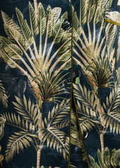 A woman wearing Beach Palm silk pajama set – tropical women’s sleepwear by LaRosa
closeup