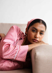 A woman in Pink Polka silk pajama set – polka dot women’s sleepwear by LaRosa