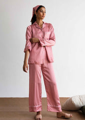 A woman in Pink Polka silk pajama set – polka dot women’s sleepwear by LaRosa
