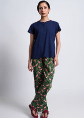 Ella – LaRosa Night Wears for Women – Cotton Summer Sets Collection | Larosawears | Shop Online – Front View.
Woman wearing a navy blue top and green pants with pink flamingo pattern on a white background