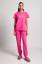 Elsie – LaRosa Night Wears for Women – Cotton Summer Sets Collection | Larosawears | Shop Online – Front View.
Women wearing a pink t-shirt and pants set on a plain background