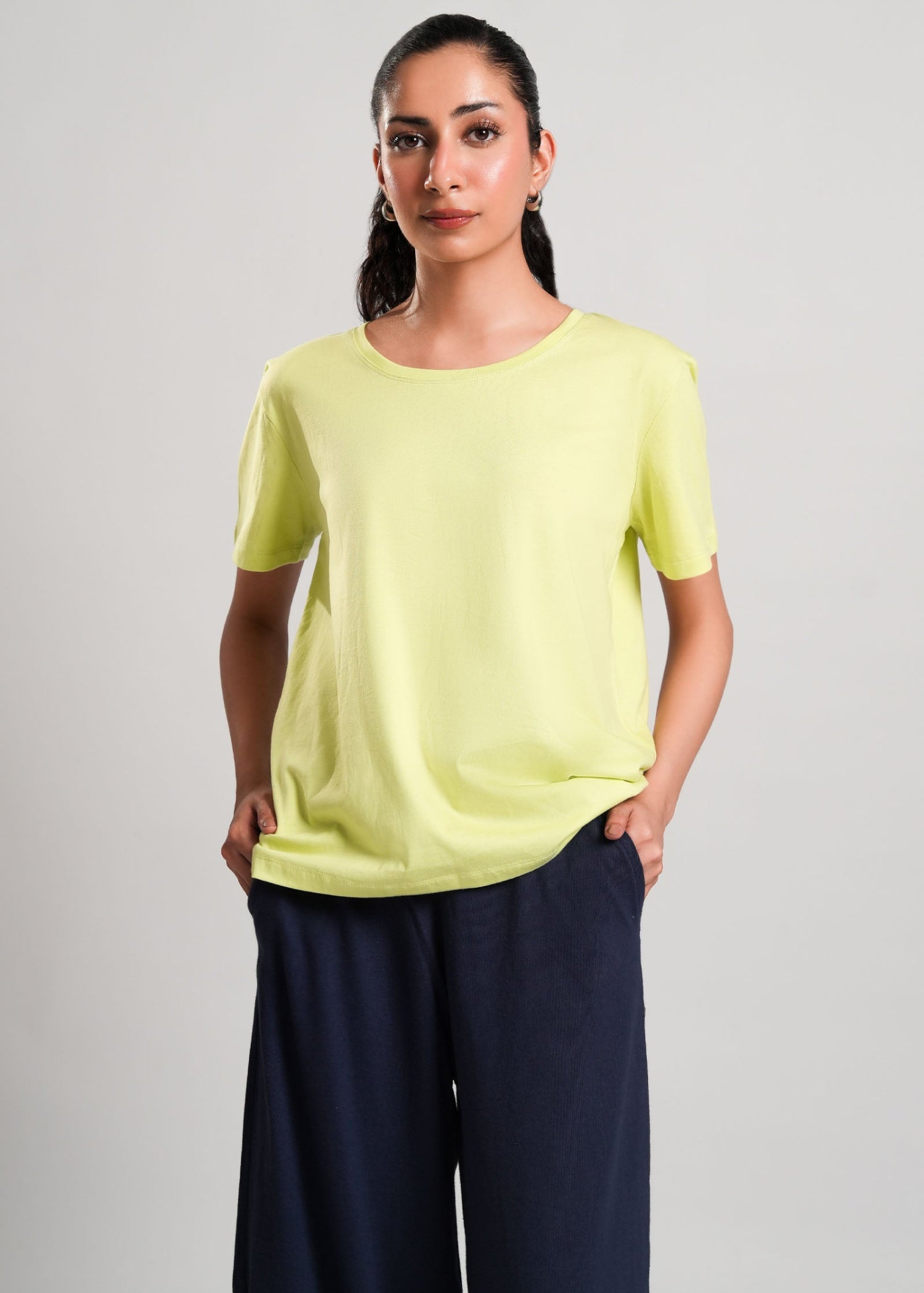 Mary – LaRosa Night Wears for Women – Cotton Summer Sets Collection | Larosawears | Shop Online – Front View.
Woman wearing a light green top and dark blue pants on a plain background