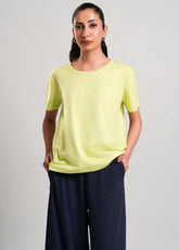 Mary – LaRosa Night Wears for Women – Cotton Summer Sets Collection | Larosawears | Shop Online – Front View.
Woman wearing a light green top and dark blue pants on a plain background