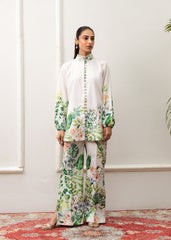 A woman modeling a floral print co-ord set with a mandarin collar and flared trousers.
LaRosa Summer Dreams Delia white cotton loungewear set for women.