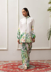 A woman modeling a floral print co-ord set with a mandarin collar and flared trousers.
LaRosa Summer Dreams Delia white cotton loungewear set for women.
