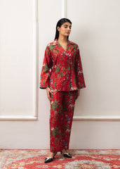 A Women wearing a double-breasted red coat with prints and culottes.
LaRosa Summer Dreams Janessa red cotton nightwear set for women, designed as a bold printed co-ord with collared shirt and straight trousers.