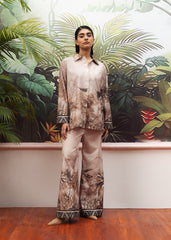 A female model wearing a beige printed co-ord set with a buttoned down shirt and flared trousers.
LaRosa Summer Dreams Isla grey cotton loungewear set for women.