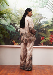 A female model wearing a beige printed co-ord set with a buttoned down shirt and flared trousers.
LaRosa Summer Dreams Isla grey cotton loungewear set for women.
back view